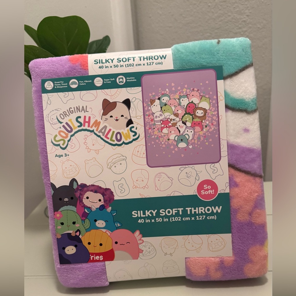 New Squishmallow soft 40x50 inch throw. This fluffy pastel colored throw is nice
